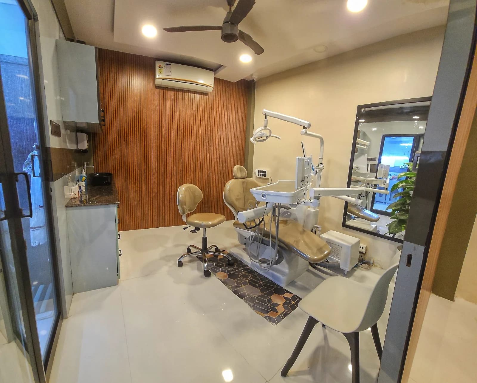 Wide interior view of a META DENTAL treatment room in Panaiyur